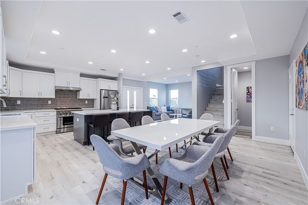 Dining room, Interior, Kitchen, Recessed Lighting, Stainless Steel Appliances, Wood Texture Flooring
