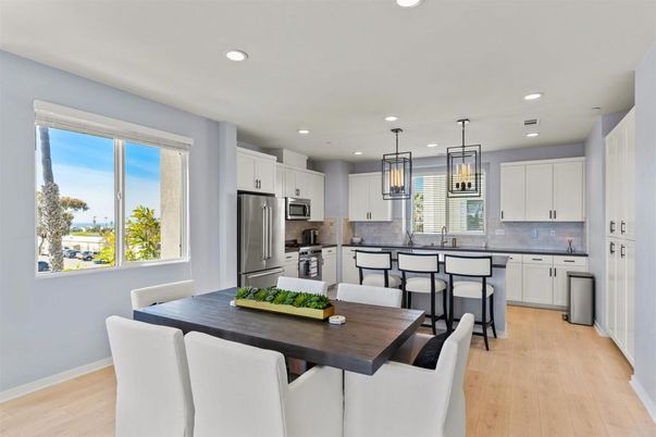 Dining room, Interior, Kitchen, Pendant Lights, Recessed Lighting, Stainless Steel Appliances, Wood Texture Flooring