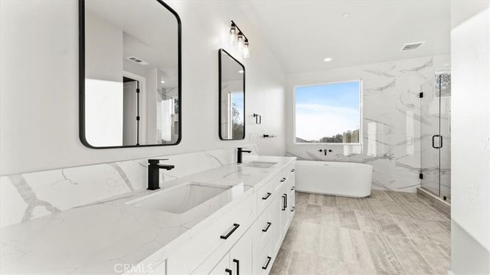 Bathroom, Dual Sink Vanities, Free Standing Baths, Glass Shower, Interior, Marble Walls, Recessed Lighting