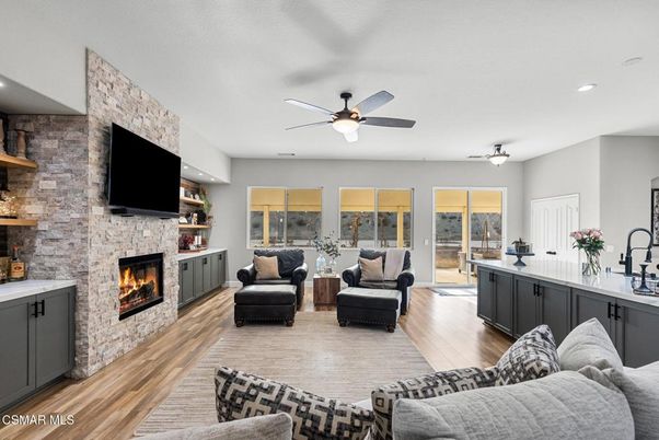 Fireplace, Interior, Living room, Recessed Lighting, Stone Walls, Wood Texture Flooring