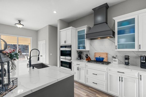 Interior, Kitchen, Marble Walls, Recessed Lighting, Stainless Steel Appliances, Wood Texture Flooring