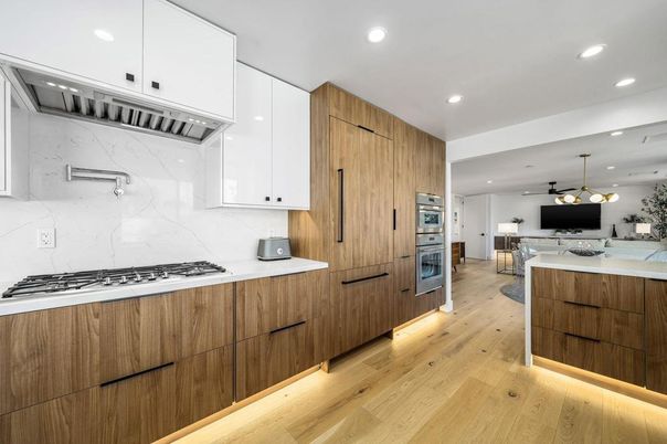 Interior, Kitchen, Marble Walls, Pendant Lights, Recessed Lighting, Stainless Steel Appliances, Wood Texture Flooring
