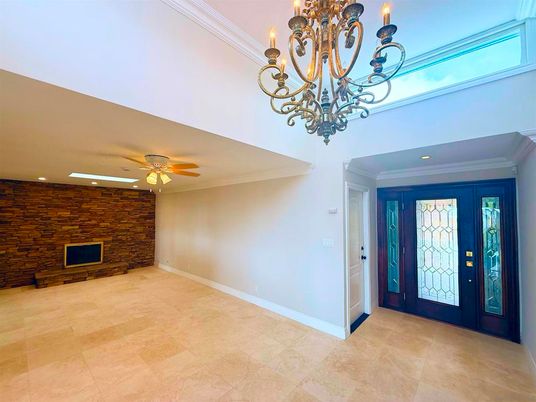 Chandelier, Empty room, Fireplace, Interior, Recessed Lighting, Stone Walls