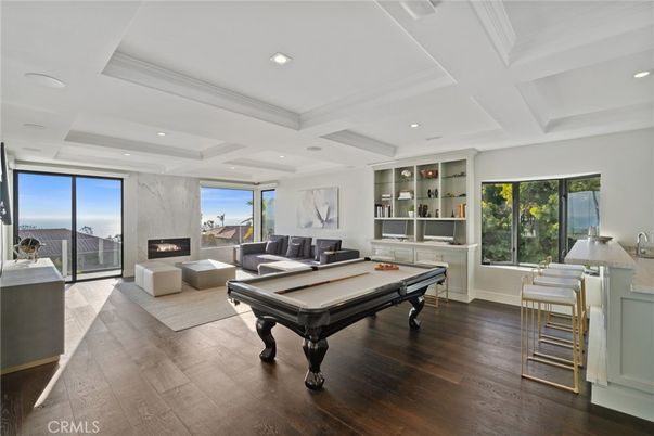 Billiard Table, Fireplace, Game Room, Interior, Living room, Recessed Lighting, Wood Texture Flooring