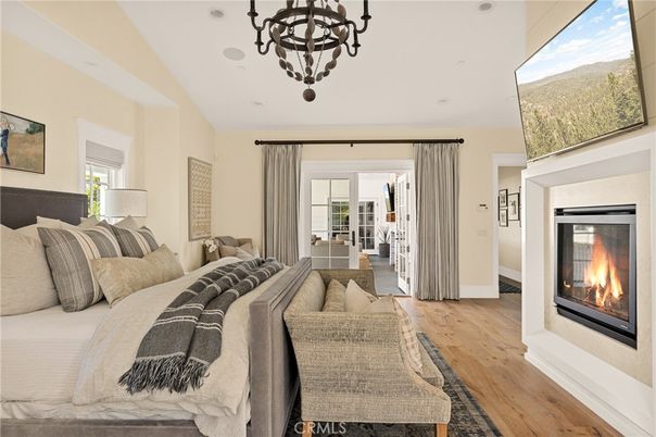 Bedroom, Chandelier, Fireplace, Interior, Living room, Recessed Lighting, Wood Texture Flooring