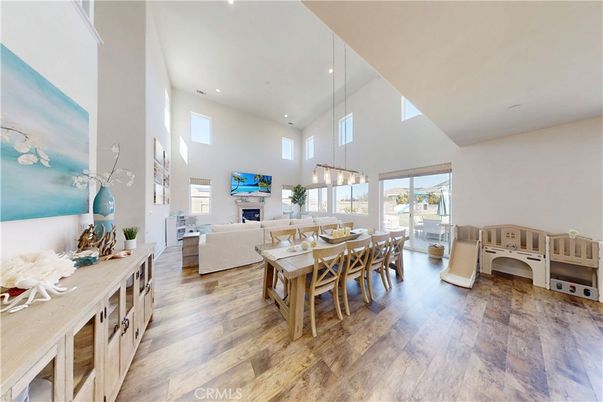 Dining room, Fireplace, Interior, Living room, Pendant Lights, Recessed Lighting, Wood Texture Flooring