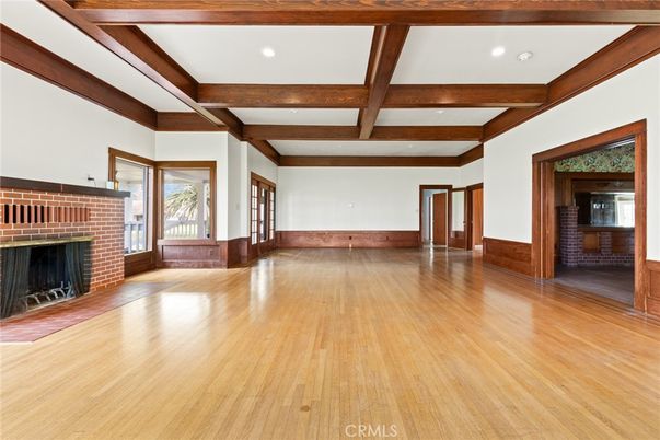 Empty room, Fireplace, Interior, Recessed Lighting, Stone Walls, Wooden Beams, Wood Texture Flooring