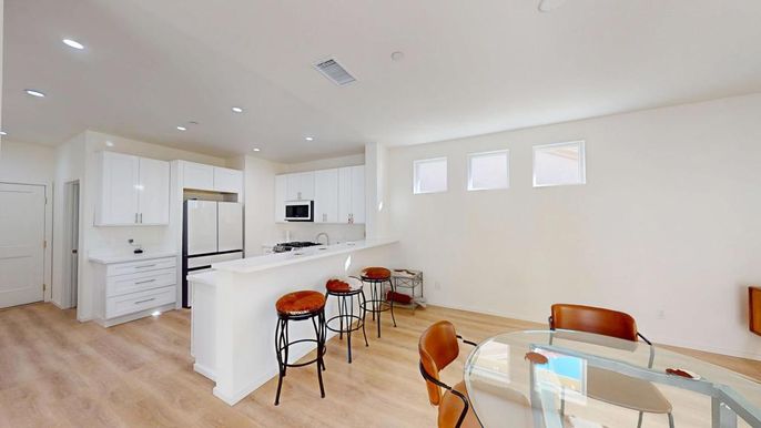 Dining room, Interior, Kitchen, Recessed Lighting, Stainless Steel Appliances, Wood Texture Flooring