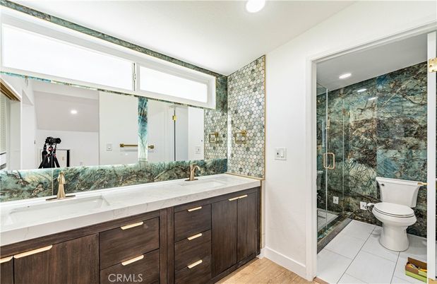 Bathroom, Dual Sink Vanities, Glass Shower, Interior, Recessed Lighting, Wood Texture Flooring