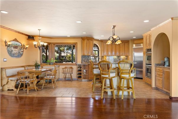 Chandelier, Dining room, Interior, Kitchen, Pendant Lights, Recessed Lighting, Stainless Steel Appliances, Wood Texture Flooring