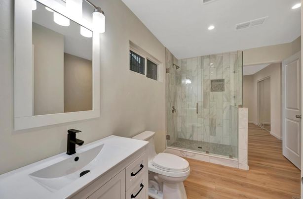 Bathroom, Glass Shower, Interior, Marble Walls, Recessed Lighting, Wood Texture Flooring