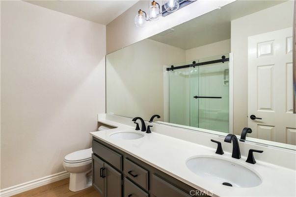 Bathroom, Dual Sink Vanities, Glass Shower, Interior, Wood Texture Flooring