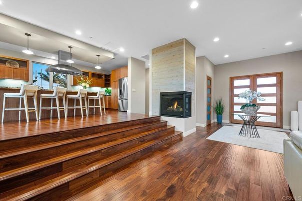 Dining room, Fireplace, Interior, Kitchen, Pendant Lights, Recessed Lighting, Stainless Steel Appliances, Stone Walls, Wood Texture Flooring