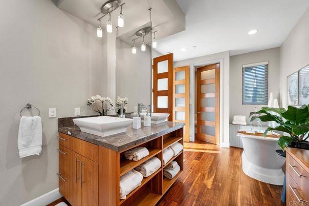 Bathroom, Dual Sink Vanities, Interior, Pendant Lights, Recessed Lighting, Wood Texture Flooring