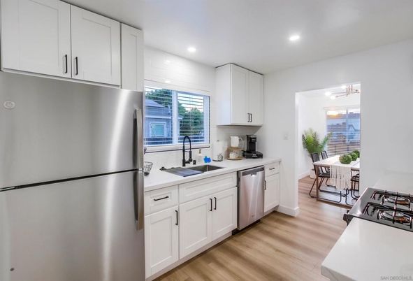 Dining room, Interior, Kitchen, Recessed Lighting, Stainless Steel Appliances, Wood Texture Flooring