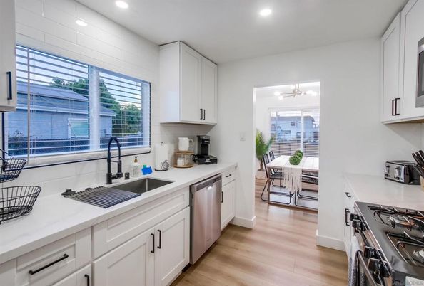 Dining room, Interior, Kitchen, Recessed Lighting, Stainless Steel Appliances, Wood Texture Flooring