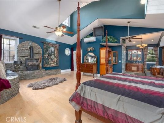 Bedroom, Chandelier, Fireplace, Interior, Recessed Lighting, Wood Texture Flooring