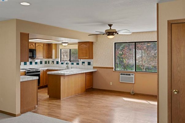 Interior, Kitchen, Recessed Lighting, Tile Countertops, Wood Texture Flooring