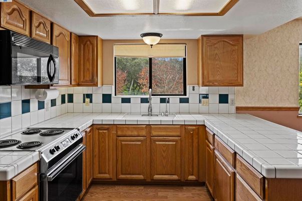 Interior, Kitchen, Tile Countertops, Wood Texture Flooring