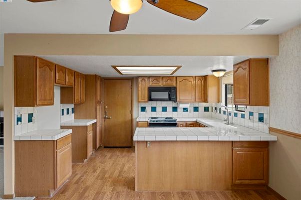 Interior, Kitchen, Tile Countertops, Wood Texture Flooring