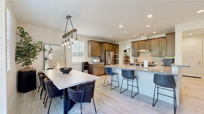 Dining room, Interior, Kitchen, Pendant Lights, Recessed Lighting, Stainless Steel Appliances, Wood Texture Flooring