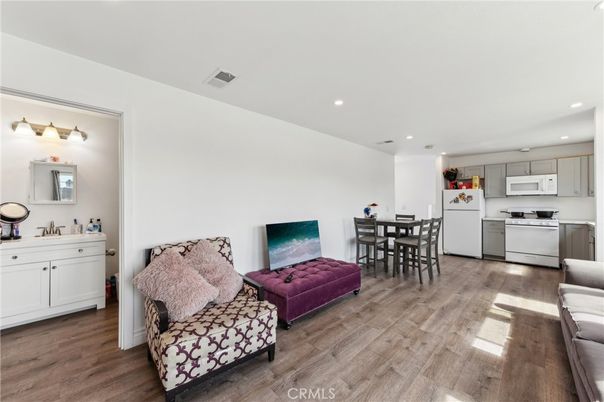 Dining room, Interior, Kitchen, Living room, Recessed Lighting, Stainless Steel Appliances, Wood Texture Flooring