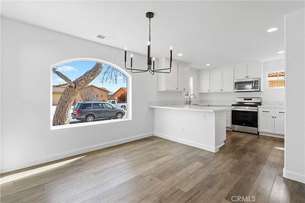 Chandelier, Interior, Kitchen, Recessed Lighting, Stainless Steel Appliances, Wood Texture Flooring