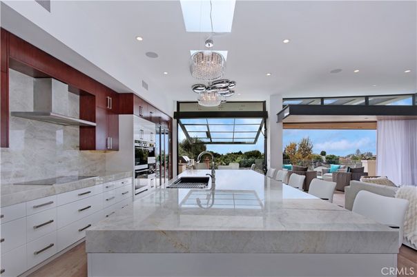 Chandelier, Dining room, Interior, Kitchen, Pendant Lights, Recessed Lighting, Stainless Steel Appliances, Wood Texture Flooring