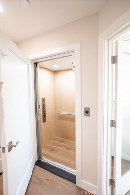 Elevator, Interior, Recessed Lighting, Wood Texture Flooring, Wooden Walls