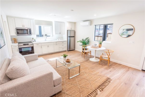 Dining room, Interior, Kitchen, Living room, Recessed Lighting, Stainless Steel Appliances, Wood Texture Flooring