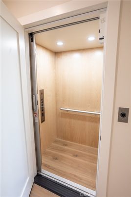 Elevator, Interior, Recessed Lighting, Wood Texture Flooring, Wooden Walls