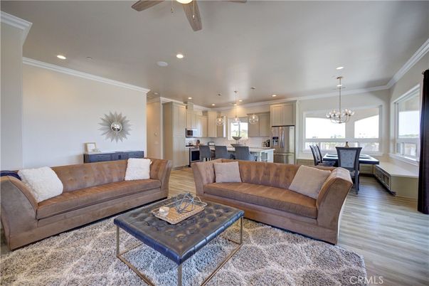 Chandelier, Dining room, Interior, Kitchen, Living room, Pendant Lights, Recessed Lighting, Stainless Steel Appliances, Wood Texture Flooring