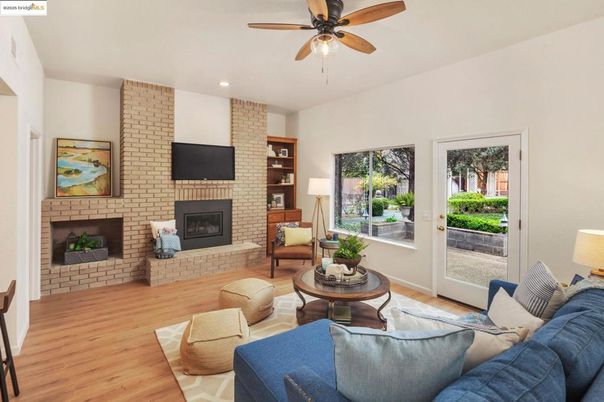 Fireplace, Interior, Living room, Recessed Lighting, Stone Walls, Wood Texture Flooring