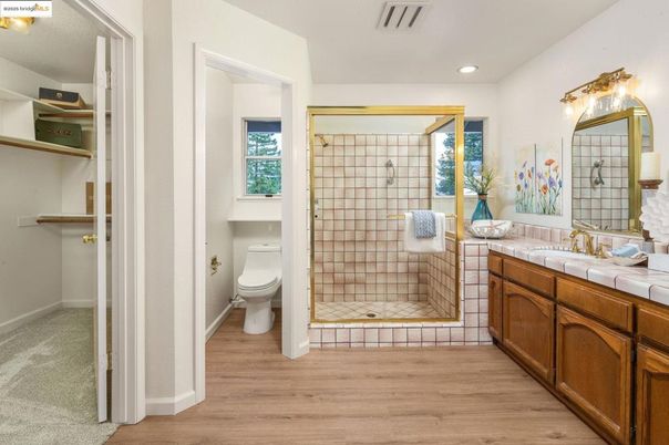 Bathroom, Glass Shower, Interior, Recessed Lighting, Tile Countertops, Wood Texture Flooring