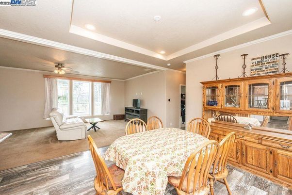 Dining room, Fireplace, Interior, Living room, Recessed Lighting, Wood Texture Flooring