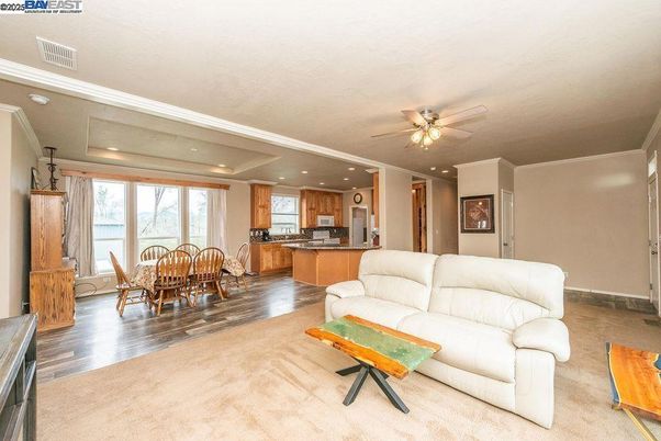 Dining room, Interior, Kitchen, Living room, Recessed Lighting, Stainless Steel Appliances, Wood Texture Flooring