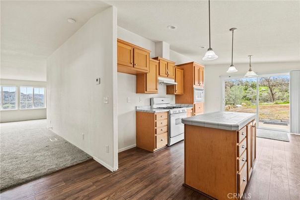 Interior, Kitchen, Pendant Lights, Recessed Lighting, Tile Countertops, Wood Texture Flooring