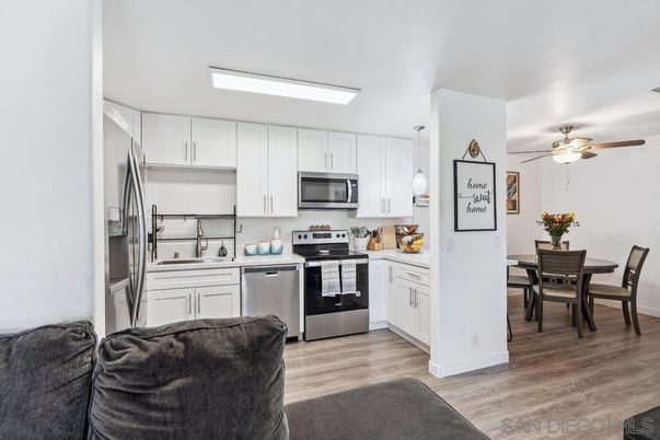 Dining room, Interior, Kitchen, Pendant Lights, Stainless Steel Appliances, Wood Texture Flooring