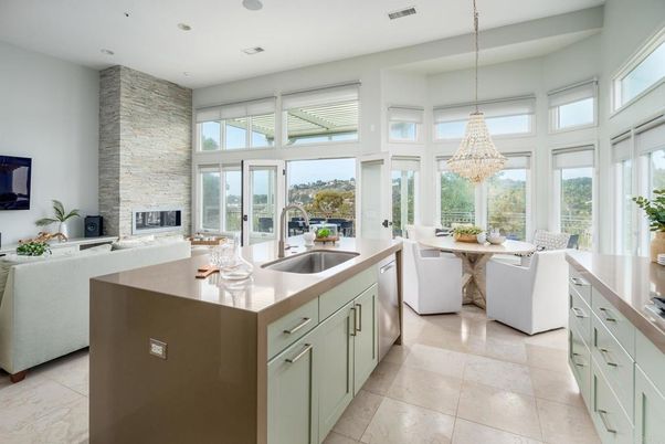 Chandelier, Dining room, Fireplace, Interior, Kitchen, Pendant Lights, Recessed Lighting, Stainless Steel Appliances, Stone Walls