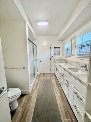Bathroom, Dual Sink Vanities, Glass Shower, Interior, Wood Texture Flooring