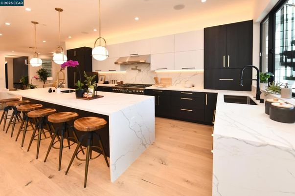Interior, Kitchen, Marble Walls, Pendant Lights, Recessed Lighting, Stainless Steel Appliances, Wood Texture Flooring