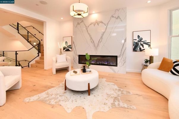 Fireplace, Interior, Living room, Marble Walls, Pendant Lights, Recessed Lighting, Wood Texture Flooring