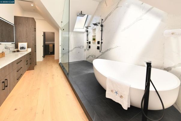 Bathroom, Free Standing Baths, Glass Shower, Interior, Marble Walls, Recessed Lighting, Wood Texture Flooring