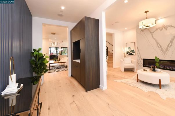 Dining room, Fireplace, Interior, Living room, Marble Walls, Pendant Lights, Recessed Lighting, Wood Texture Flooring