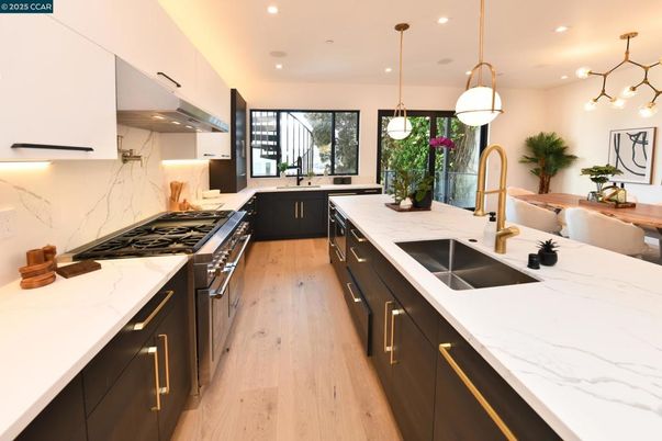 Interior, Kitchen, Marble Walls, Pendant Lights, Recessed Lighting, Wood Texture Flooring