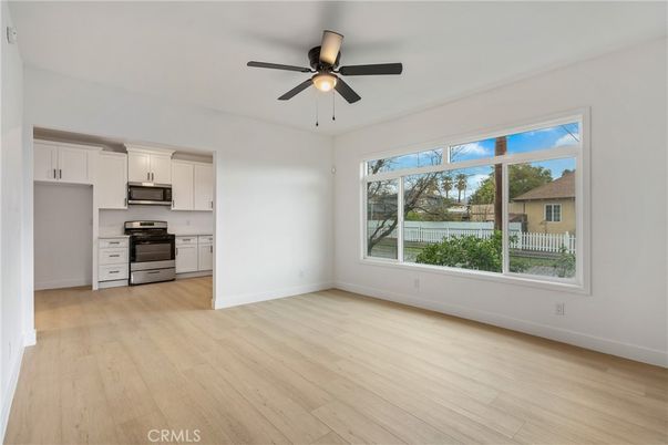 Empty room, Interior, Kitchen, Stainless Steel Appliances, Wood Texture Flooring