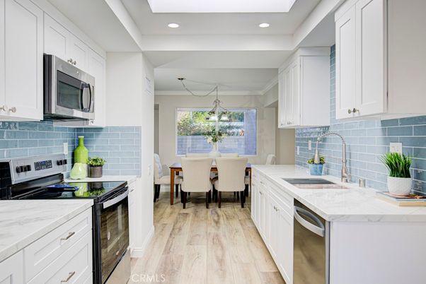 Dining room, Interior, Kitchen, Recessed Lighting, Stainless Steel Appliances, Wood Texture Flooring