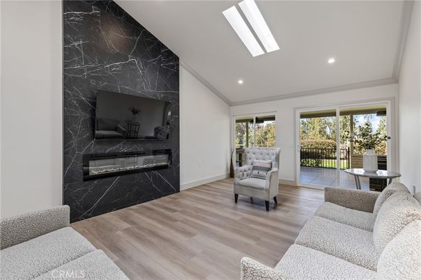 Fireplace, Interior, Living room, Marble Walls, Recessed Lighting, Wood Texture Flooring
