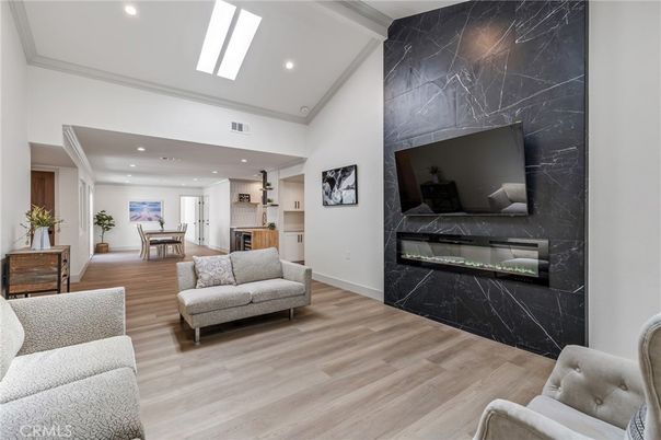 Dining room, Fireplace, Interior, Living room, Marble Walls, Recessed Lighting, Wood Texture Flooring