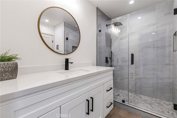 Bathroom, Glass Shower, Interior, Marble Walls, Recessed Lighting, Wood Texture Flooring